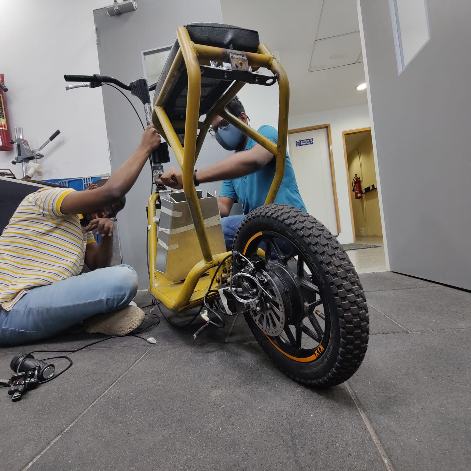 Team assembly session on the KIX electric scooter prototype